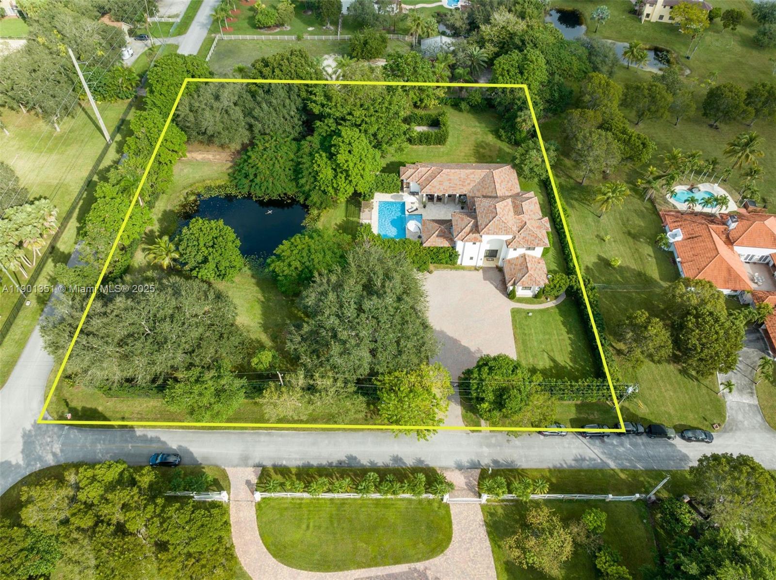 18951 Southwest 53rd Street Southwest Ranches, FL 33332 - Photo 1 of 57 an aerial view of a residential houses with outdoor space and a lake view