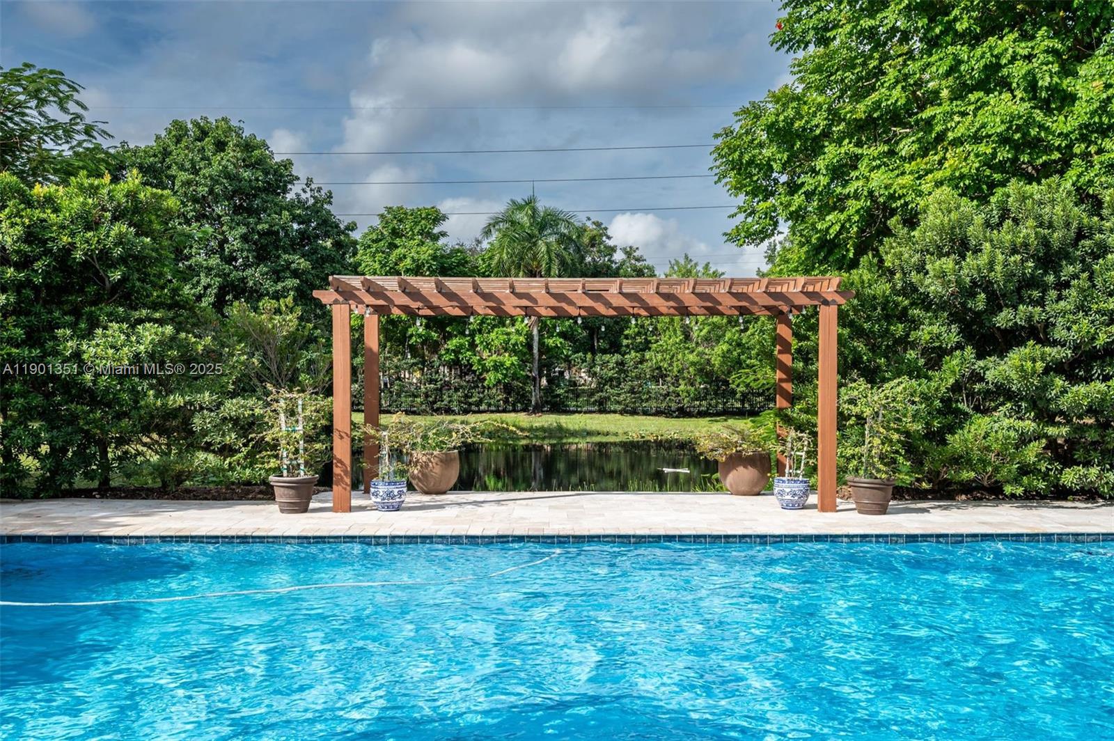 18951 Southwest 53rd Street Southwest Ranches, FL 33332 - Photo 17 of 57 a view of outdoor space with swimming pool