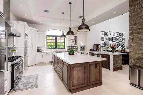 a kitchen with stainless steel appliances a stove and a refrigerator