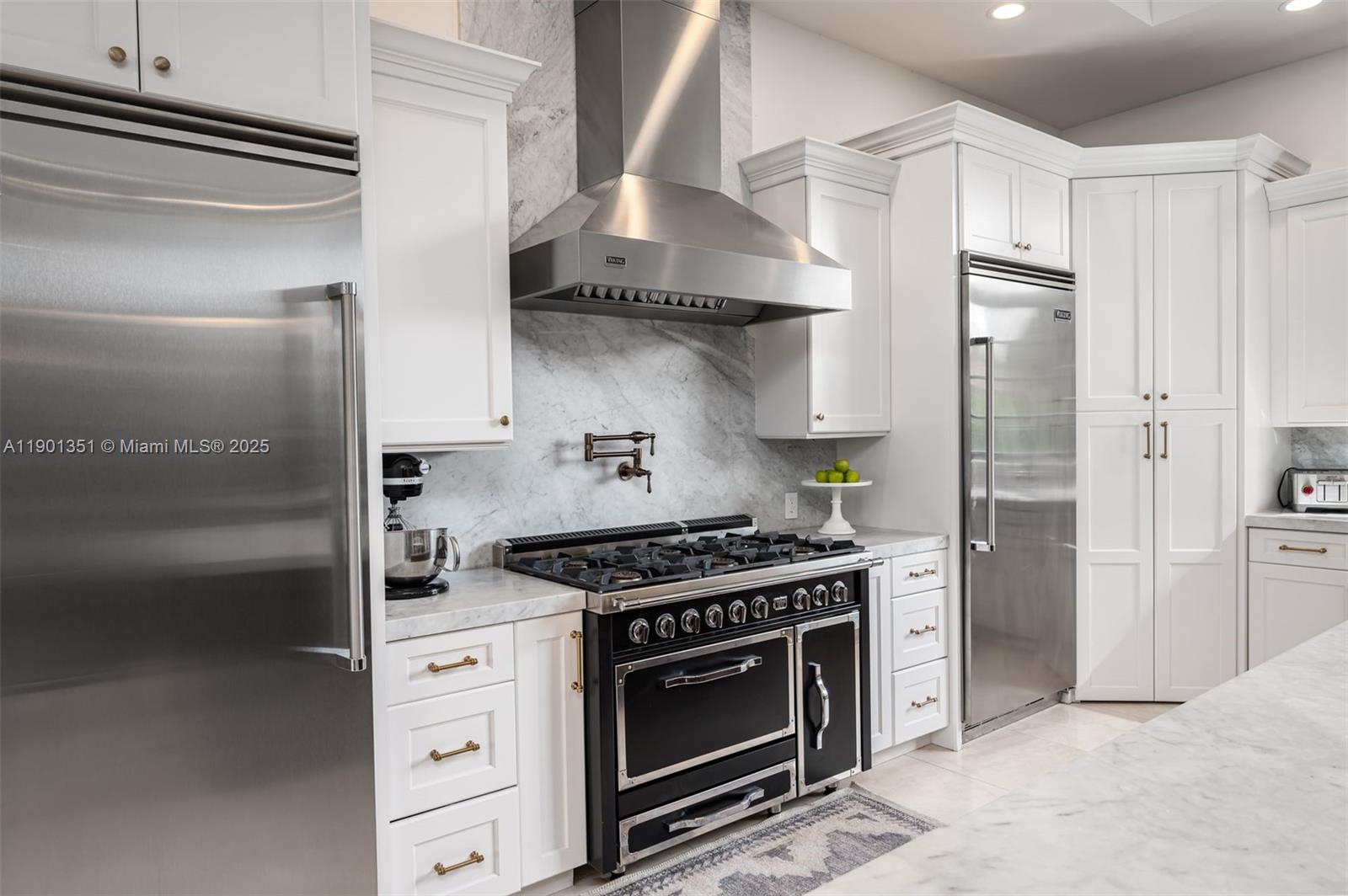18951 Southwest 53rd Street Southwest Ranches, FL 33332 - Photo 22 of 57 a kitchen with stainless steel appliances a stove and a refrigerator