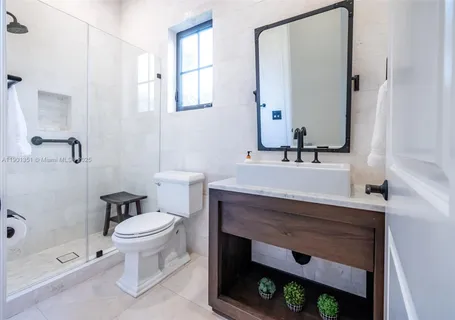 a bathroom with a sink a mirror and a bathtub