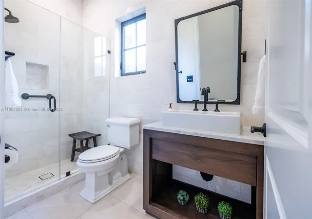 a bathroom with a sink a mirror and a bathtub