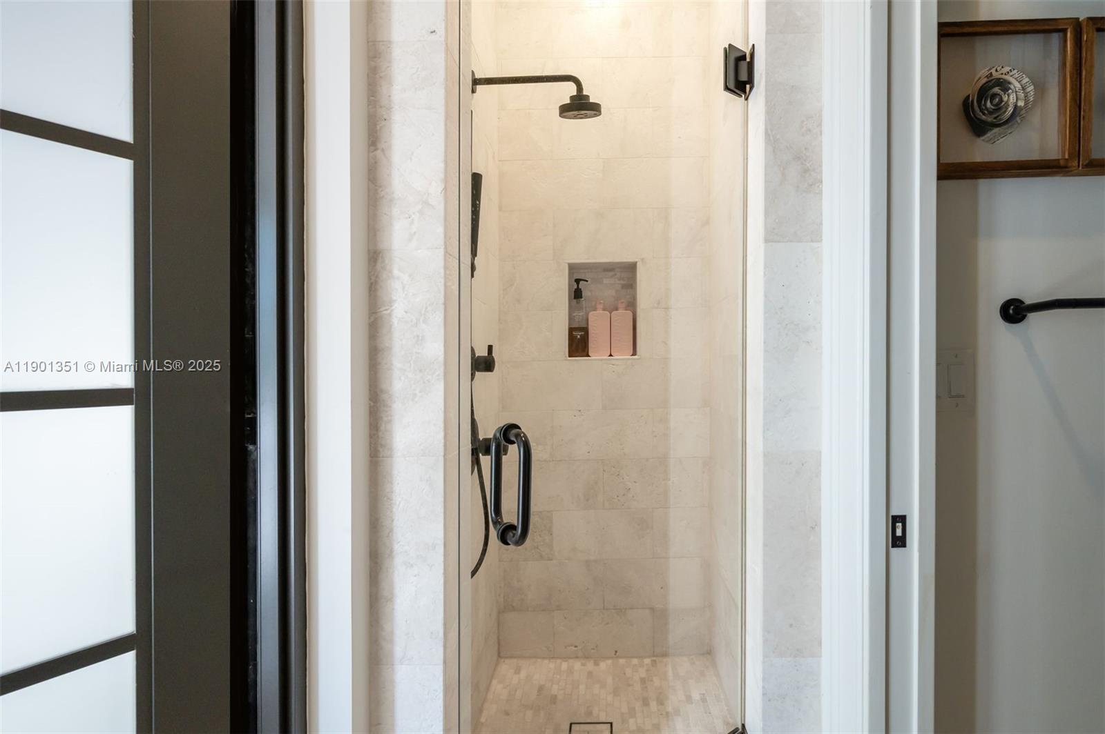 18951 Southwest 53rd Street Southwest Ranches, FL 33332 - Photo 34 of 57 a bathroom with a glass shower door