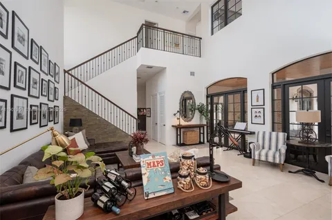 a dining room with furniture water view and a large window