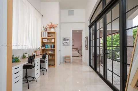 a bedroom with a large bed and furniture