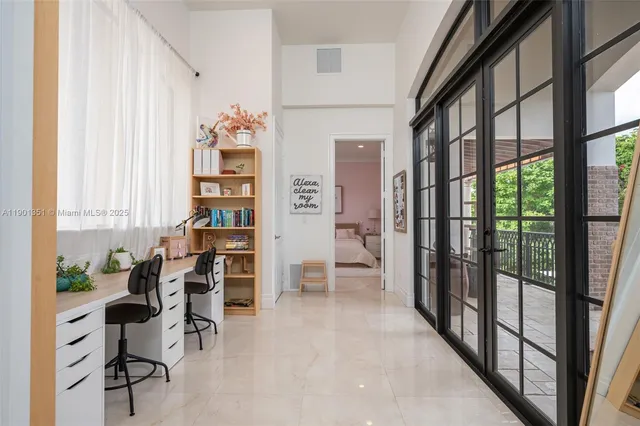 a bedroom with a large bed and furniture