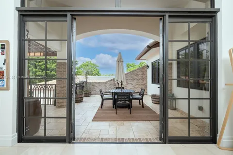 a bathroom with a granite countertop sink a toilet a mirror and shower