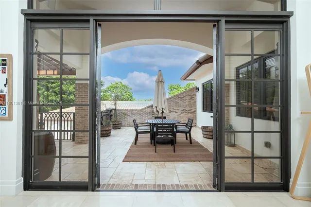 a bathroom with a granite countertop sink a toilet a mirror and shower