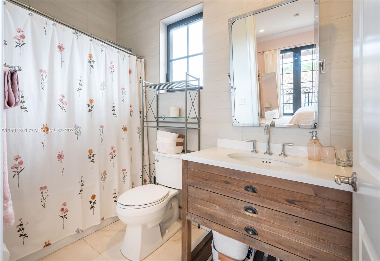 18951 Southwest 53rd Street Southwest Ranches, FL 33332 - Photo 45 of 57 a bathroom with a granite countertop sink a toilet a mirror and shower