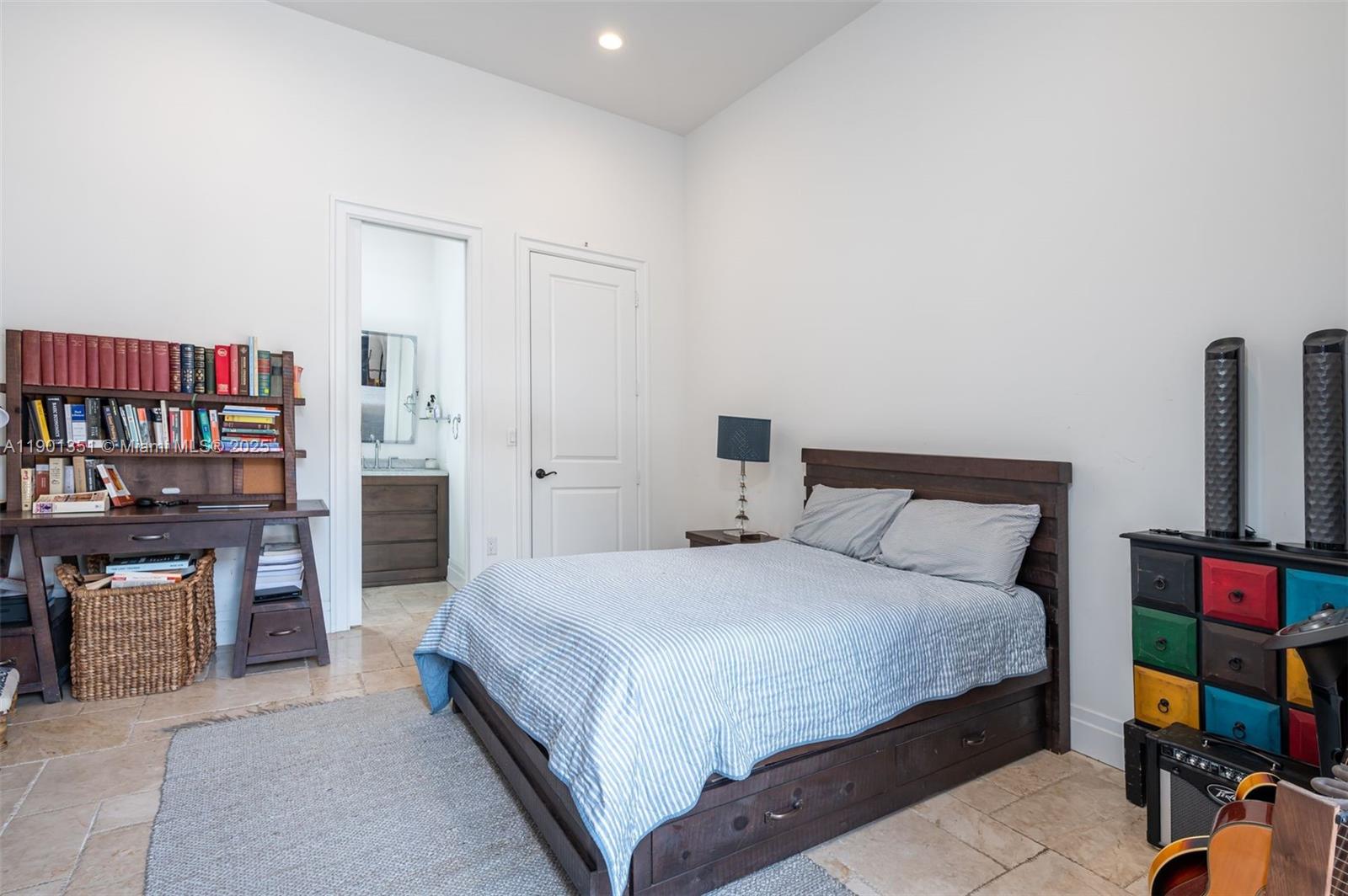 18951 Southwest 53rd Street Southwest Ranches, FL 33332 - Photo 48 of 57 a bedroom with a bed and furniture