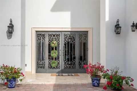 a view of a entryway door front of a house
