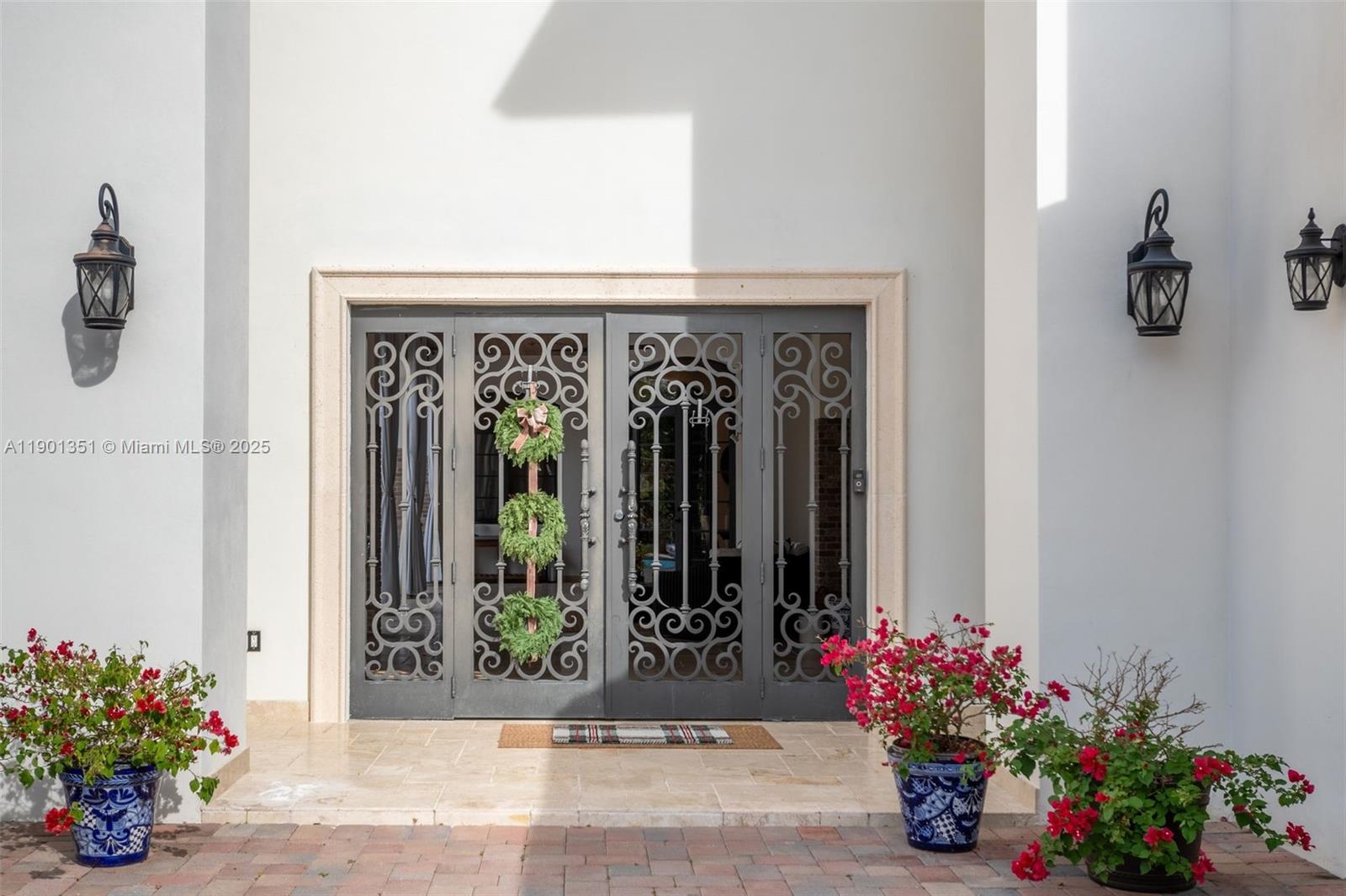 18951 Southwest 53rd Street Southwest Ranches, FL 33332 - Photo 5 of 57 a view of a entryway with flower pots