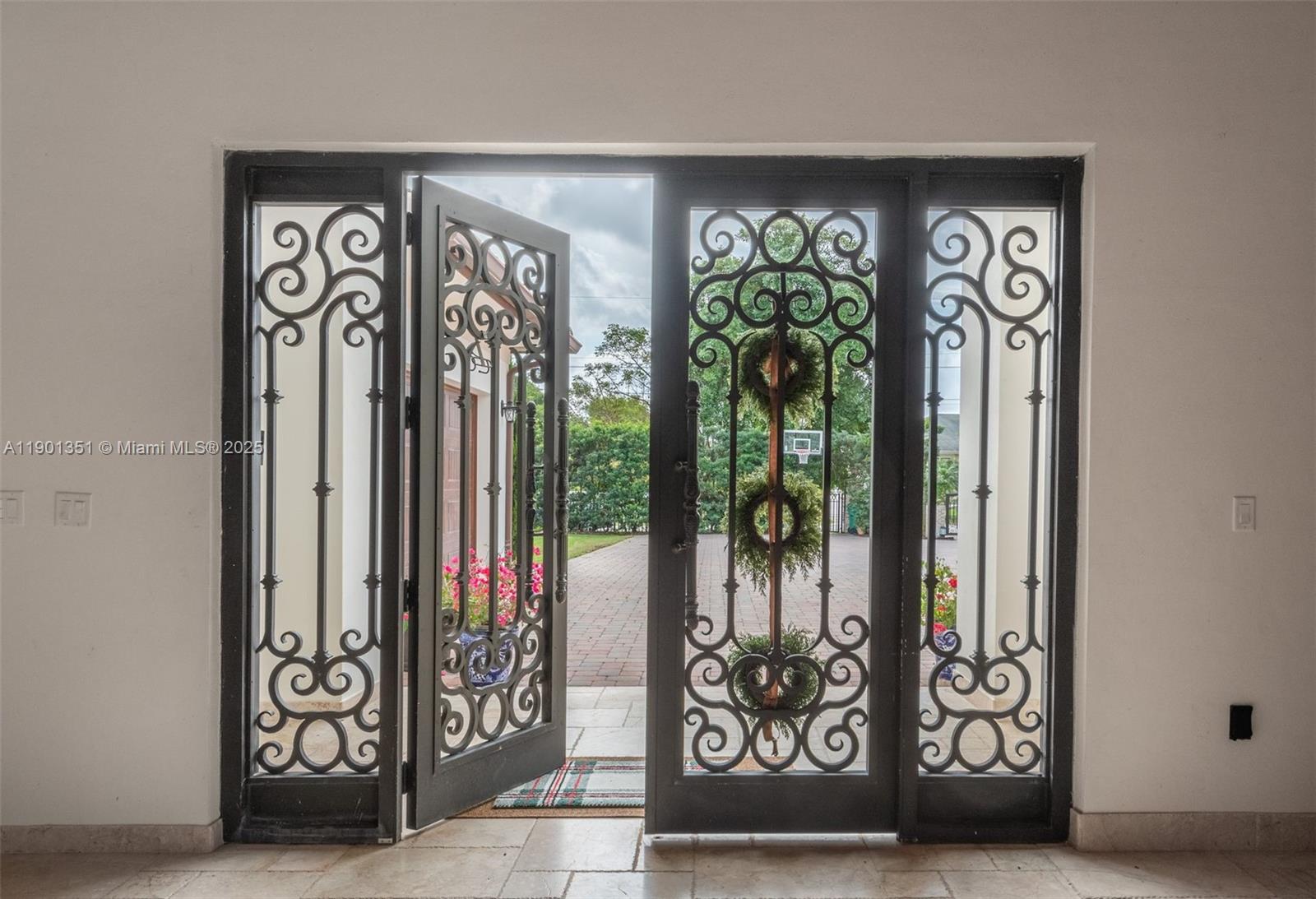 18951 Southwest 53rd Street Southwest Ranches, FL 33332 - Photo 6 of 57 a view of a entryway door front of a house