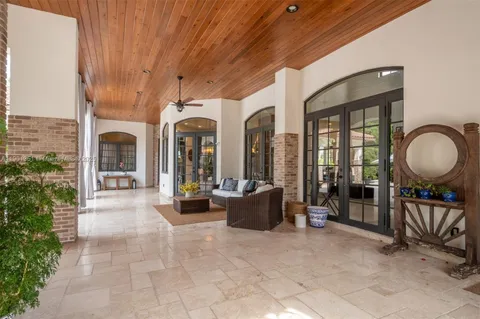 a view of a house with porch and furniture