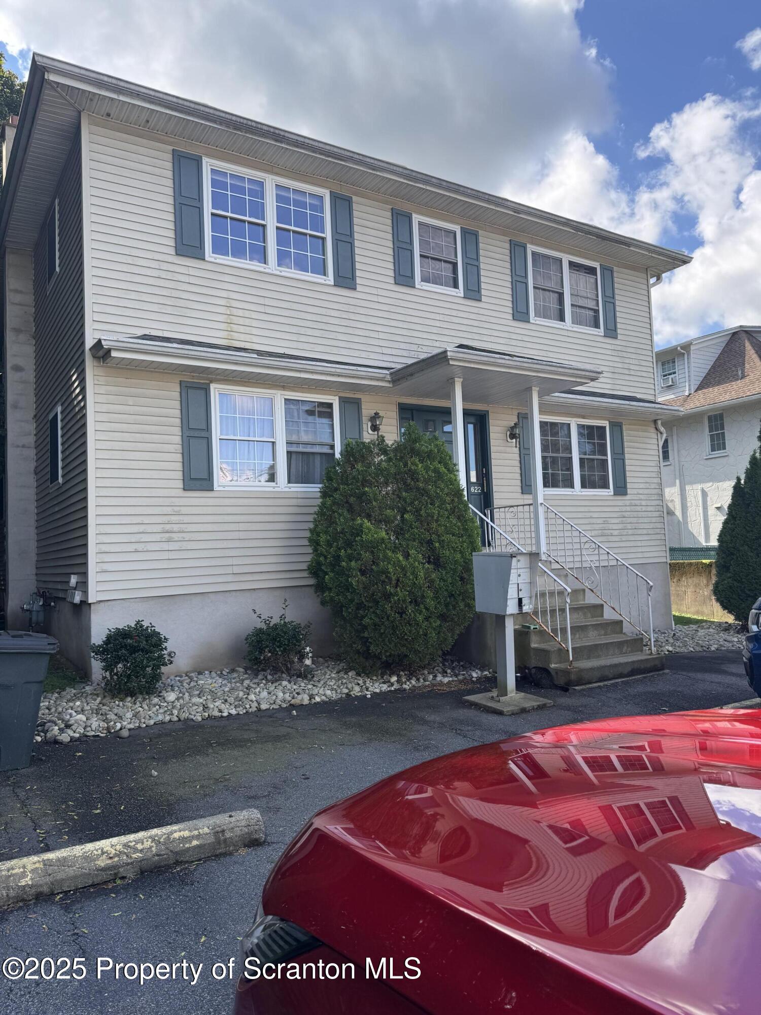 622 Terrace Street, Unit 1R Dunmore, PA 18512 - Photo 1 of 17 a front view of a house with garden