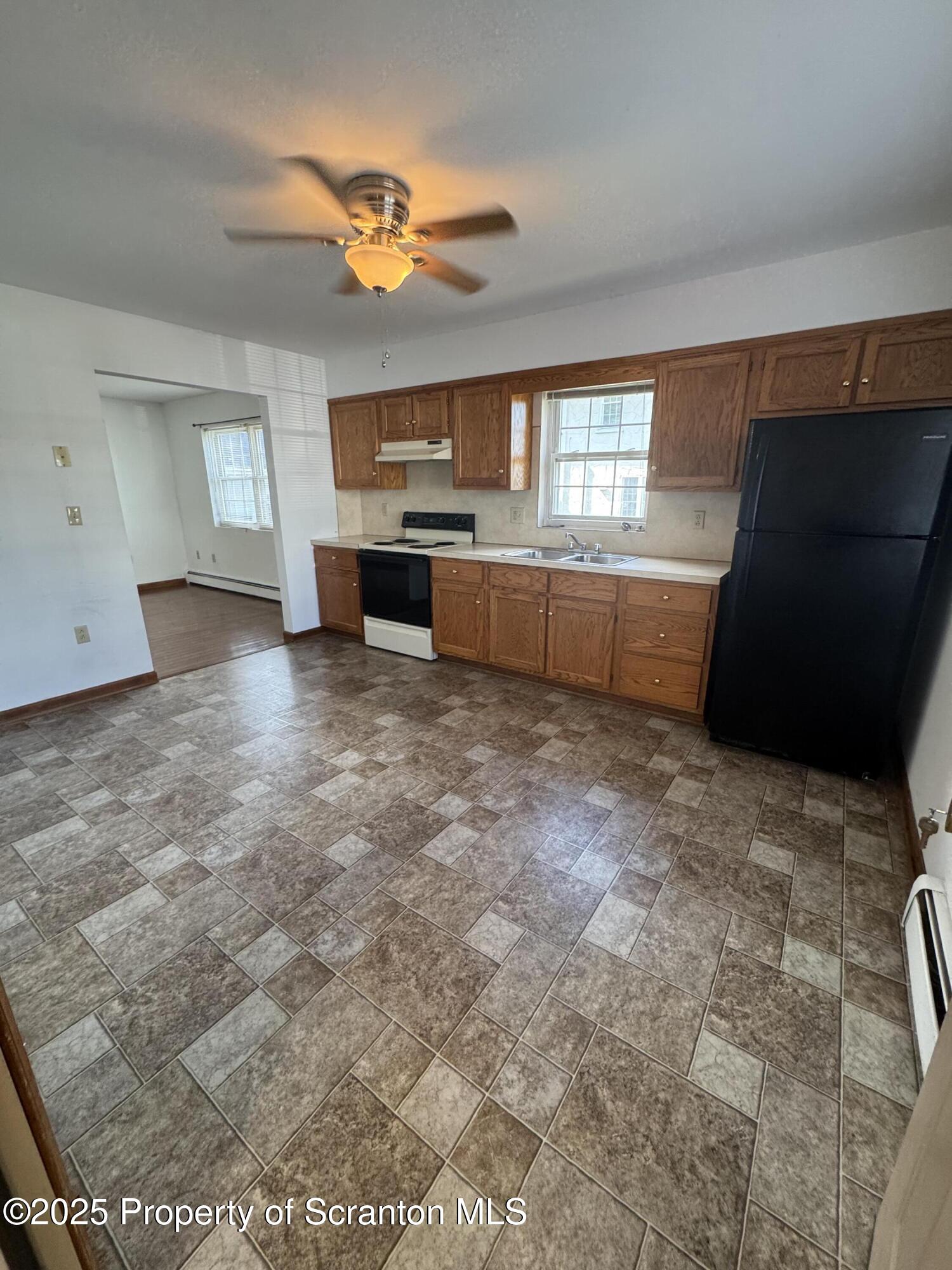 622 Terrace Street, Unit 1R Dunmore, PA 18512 - Photo 2 of 17 a view of a kitchen with a sink cabinets and a dishwasher