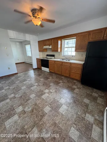 a view of a kitchen with a sink and dishwasher kitchen view
