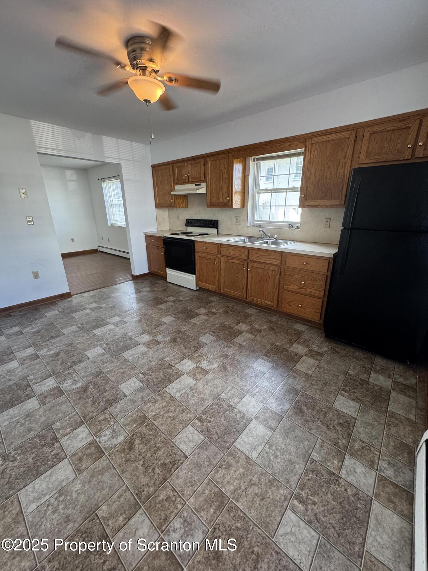 622 Terrace Street, Unit 1R Dunmore, PA 18512 - Photo 3 of 17 a view of a kitchen with a sink and dishwasher kitchen view