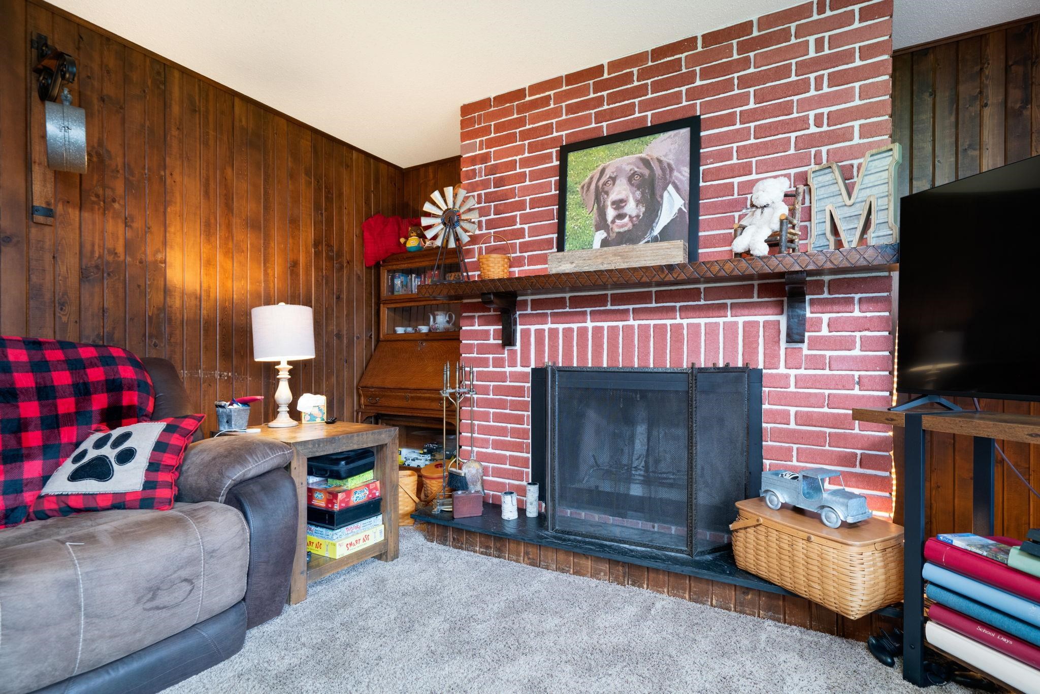 109 13th Street Oregon, IL 61061 - Photo 12 of 44 a living room with furniture and a fireplace