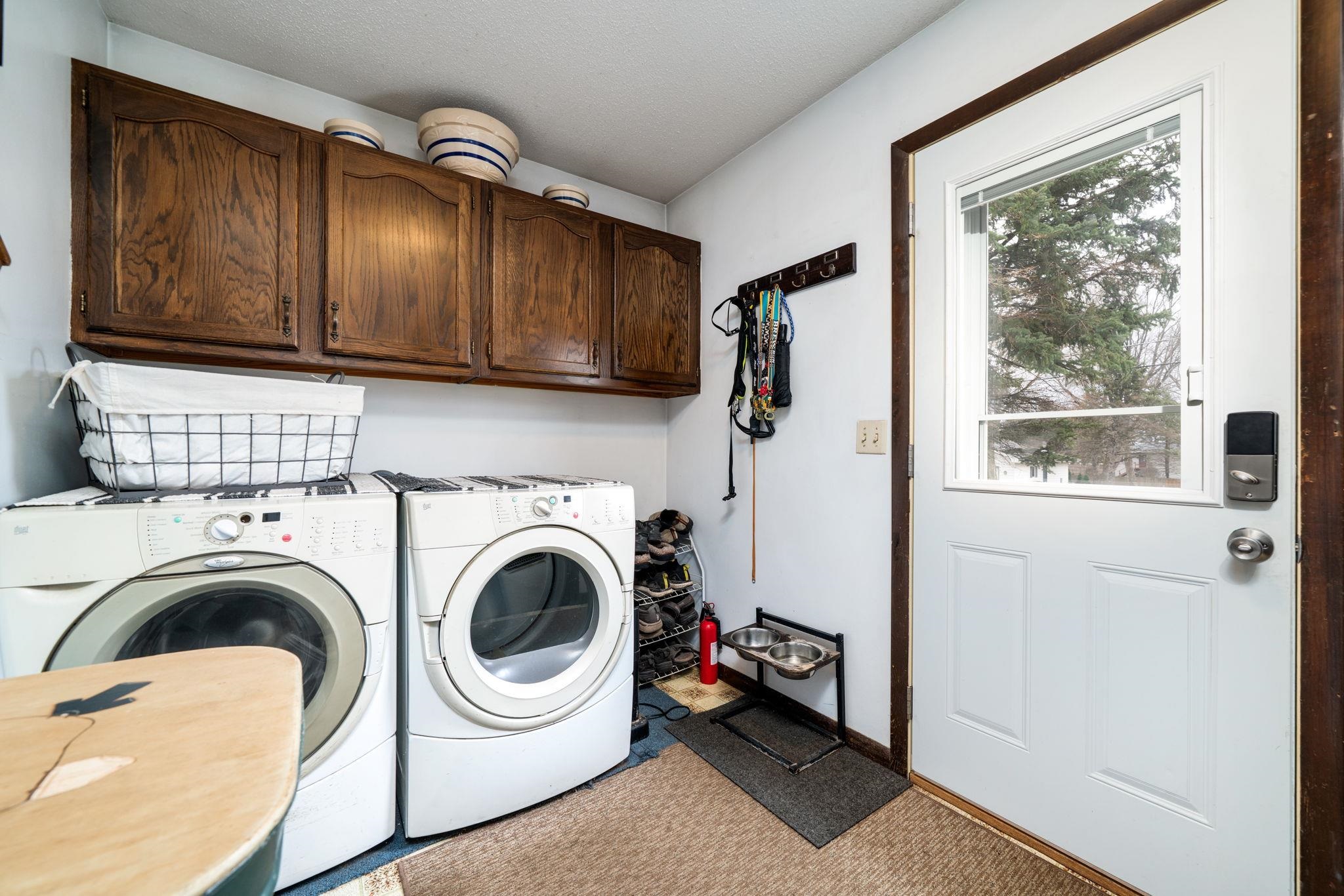 109 13th Street Oregon, IL 61061 - Photo 14 of 44 a view of a storage & utility room with washer and dryer