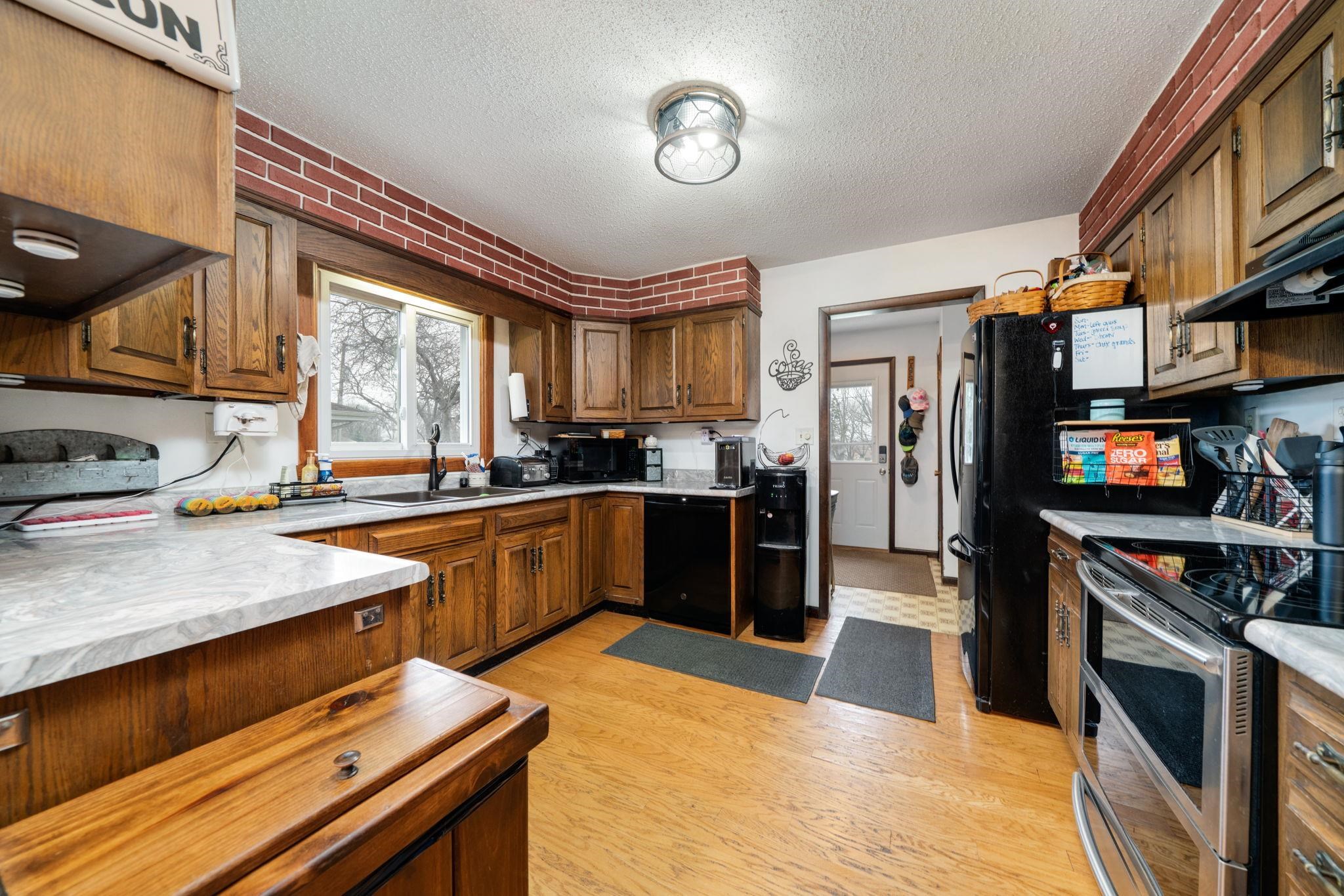 109 13th Street Oregon, IL 61061 - Photo 17 of 44 a kitchen with stainless steel appliances a stove sink and refrigerator