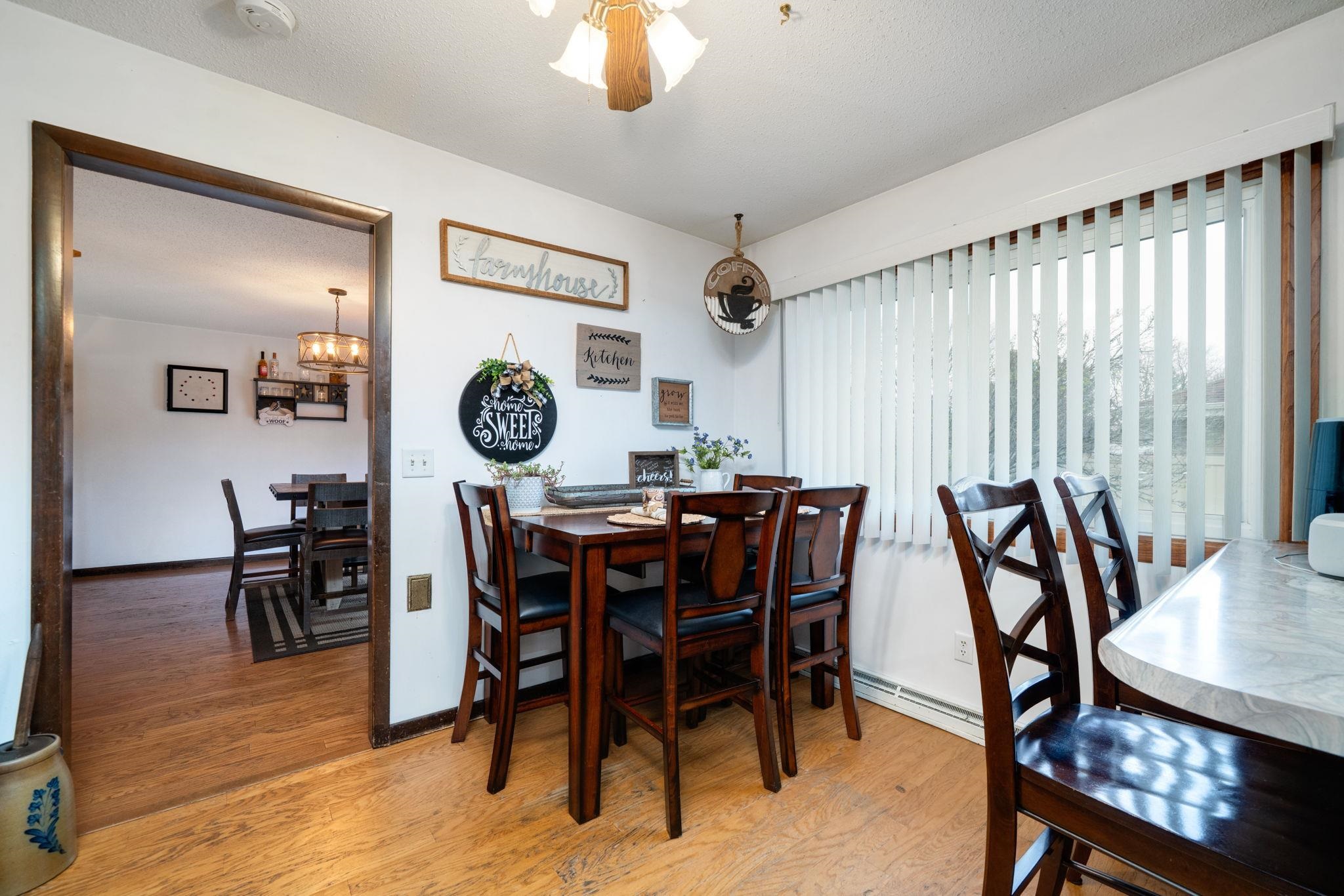 109 13th Street Oregon, IL 61061 - Photo 19 of 44 a view of a dining room with furniture and chandelier