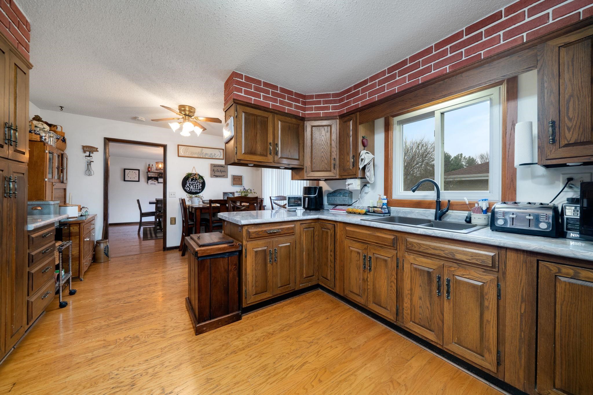 109 13th Street Oregon, IL 61061 - Photo 2 of 44 a kitchen with stainless steel appliances granite countertop a stove sink and cabinets