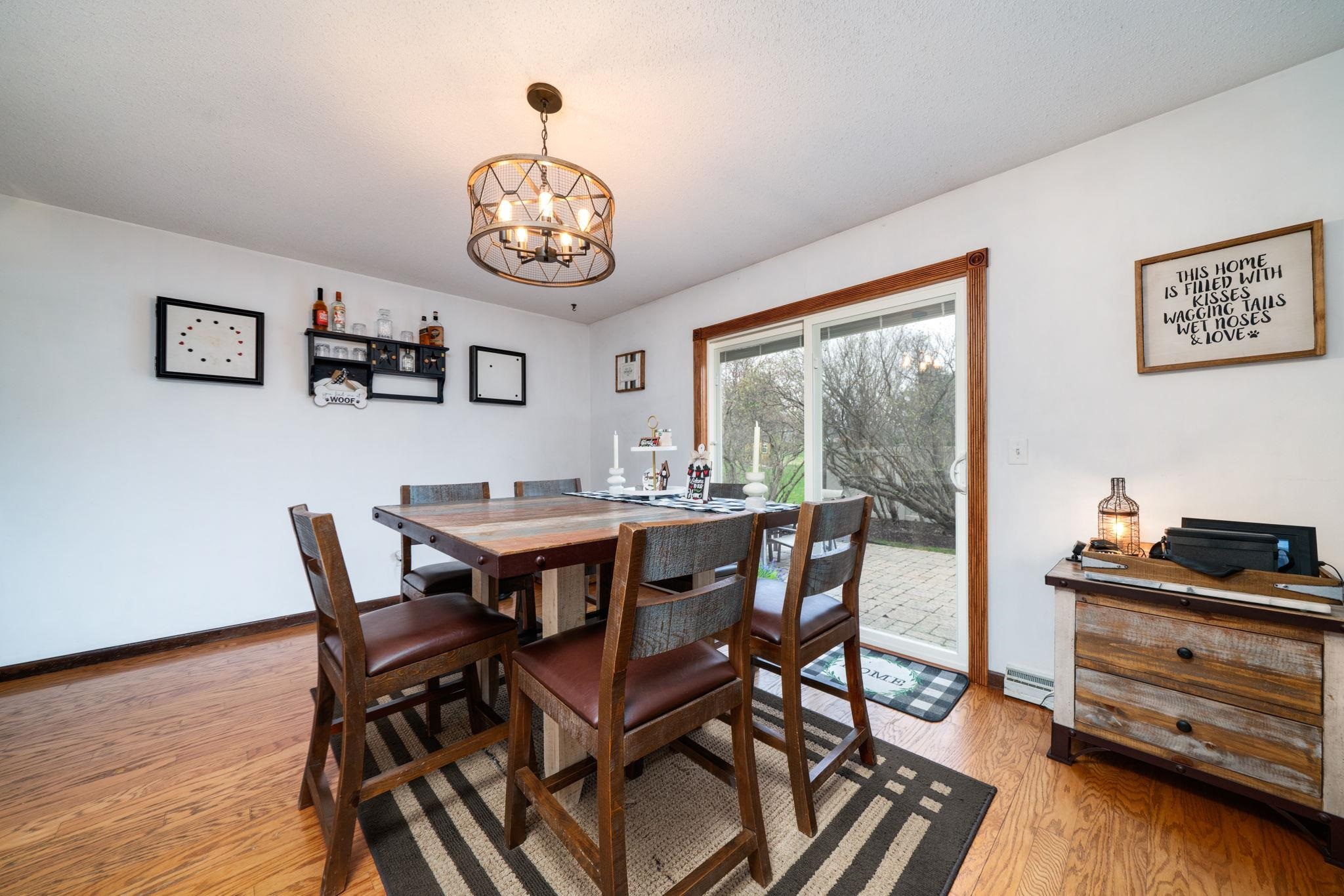109 13th Street Oregon, IL 61061 - Photo 21 of 44 a view of a dining room and livingroom with furniture wooden floor and a window