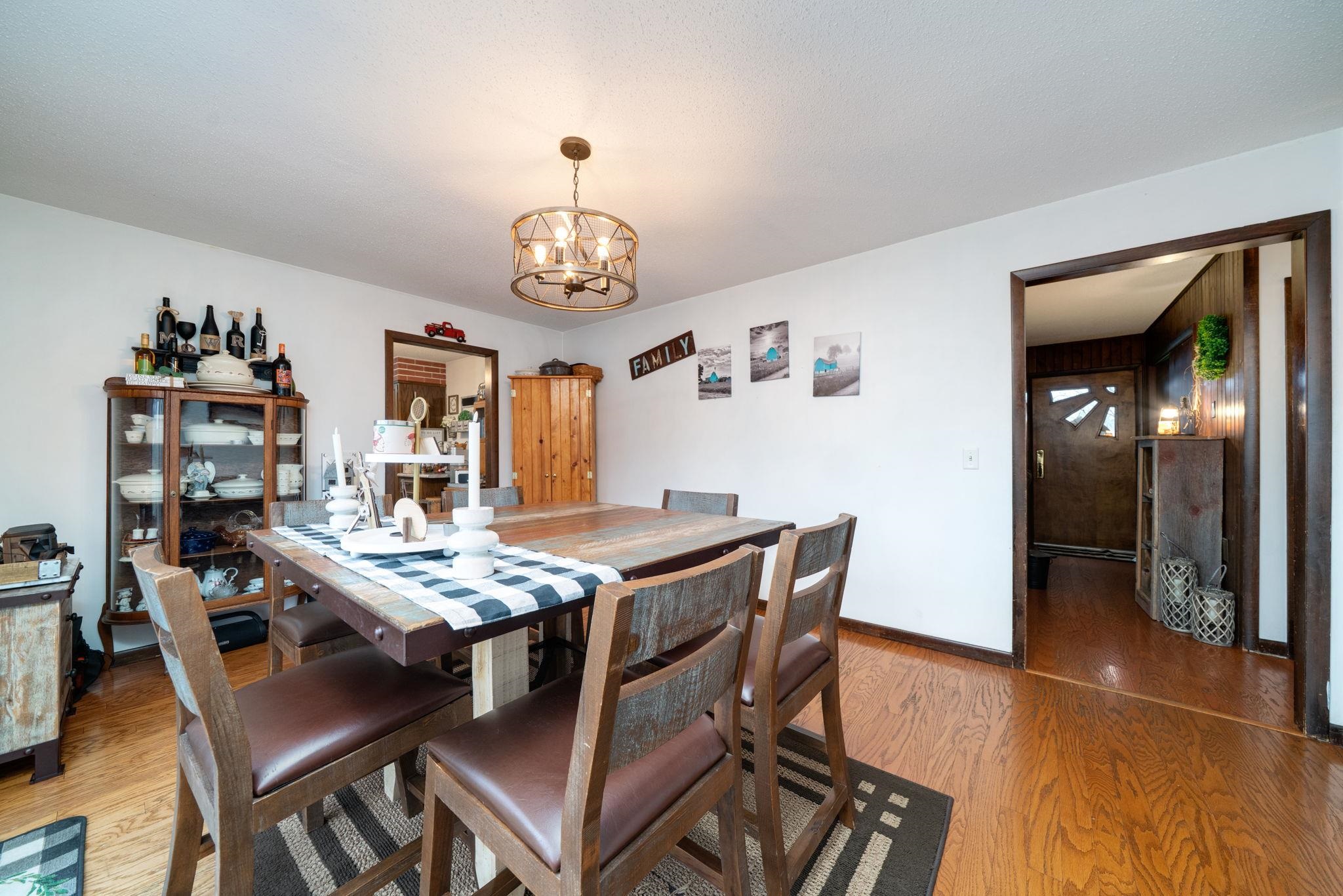 109 13th Street Oregon, IL 61061 - Photo 22 of 44 a view of a dining room with furniture and chandelier