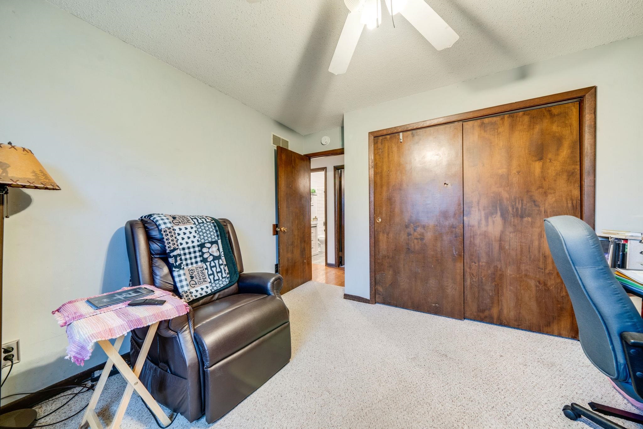 109 13th Street Oregon, IL 61061 - Photo 24 of 44 a bedroom with a bed a couch and dresser
