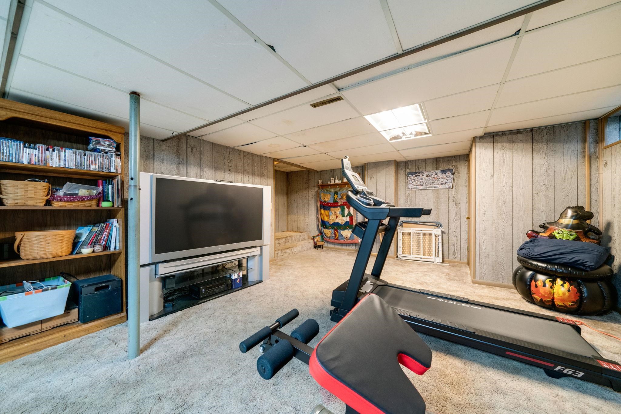 109 13th Street Oregon, IL 61061 - Photo 28 of 44 a living room with furniture and a flat screen tv