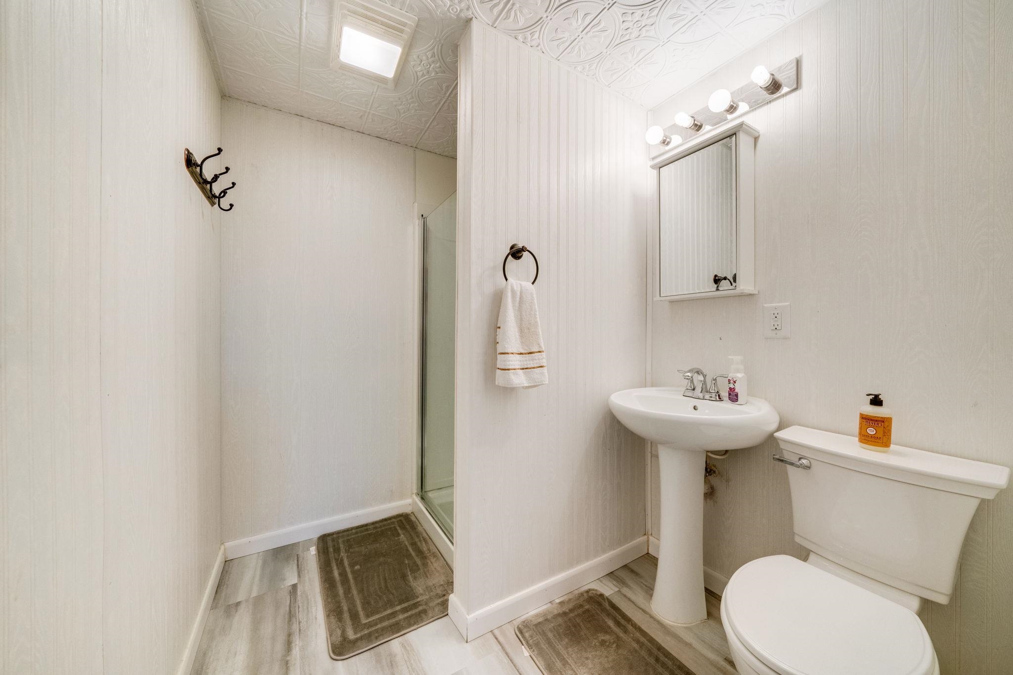 109 13th Street Oregon, IL 61061 - Photo 31 of 44 a bathroom with a sink toilet and shower