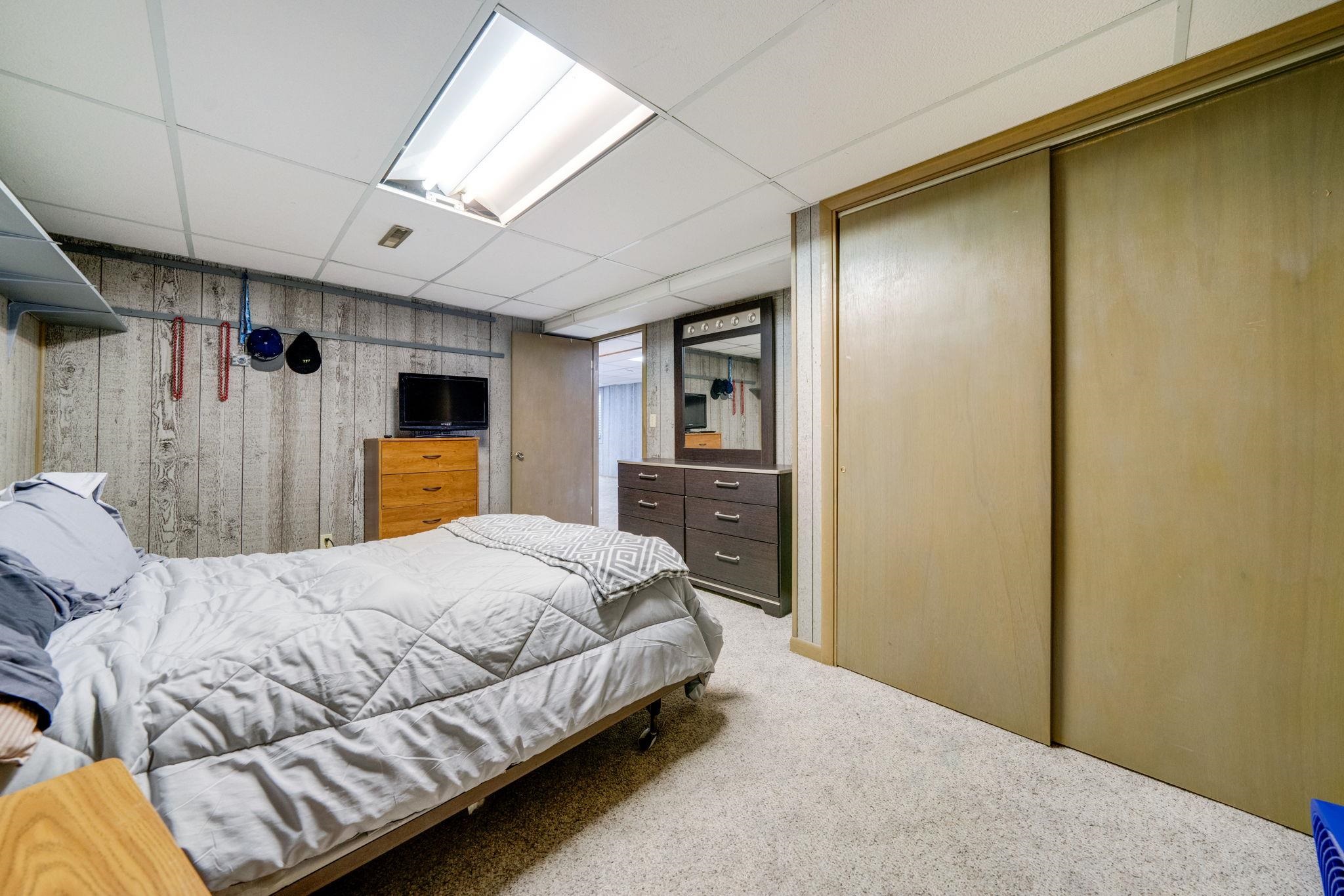 109 13th Street Oregon, IL 61061 - Photo 33 of 44 a bedroom with a bed couch and a dresser