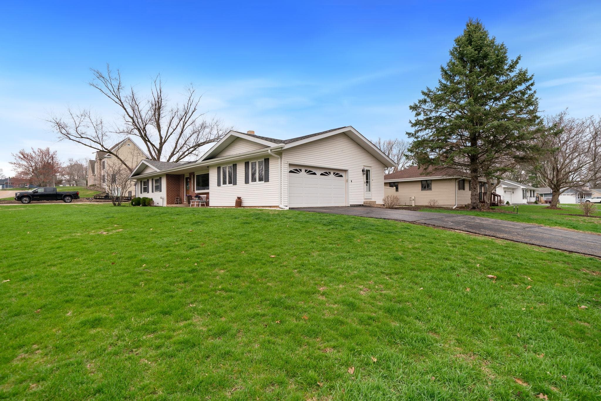 109 13th Street Oregon, IL 61061 - Photo 39 of 44 a view of a house with a big yard and large trees