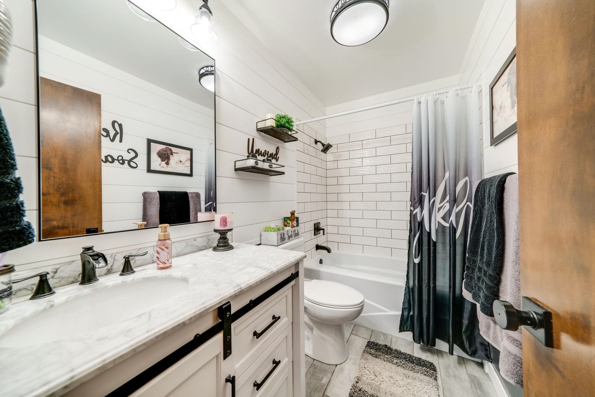 109 13th Street Oregon, IL 61061 - Photo 5 of 44 a bathroom with a granite countertop sink mirror vanity and toilet