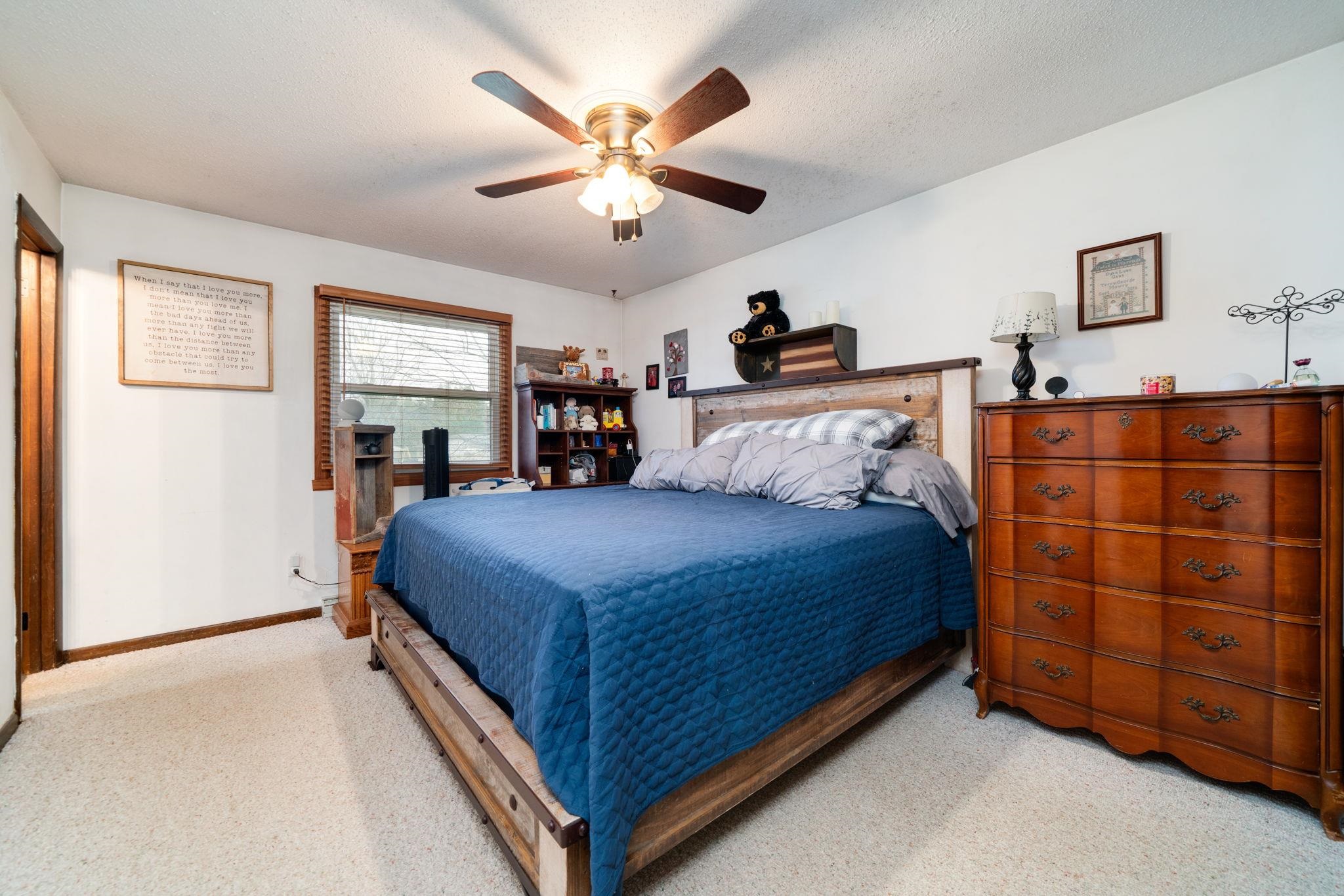109 13th Street Oregon, IL 61061 - Photo 6 of 44 a bedroom with a bed and a cabinets