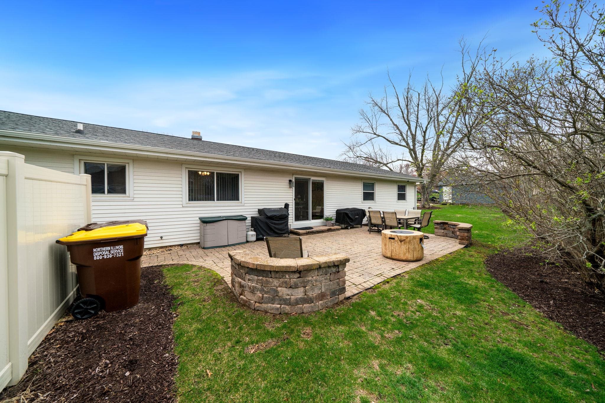 109 13th Street Oregon, IL 61061 - Photo 9 of 44 a view of a house with backyard sitting area and swimming pool