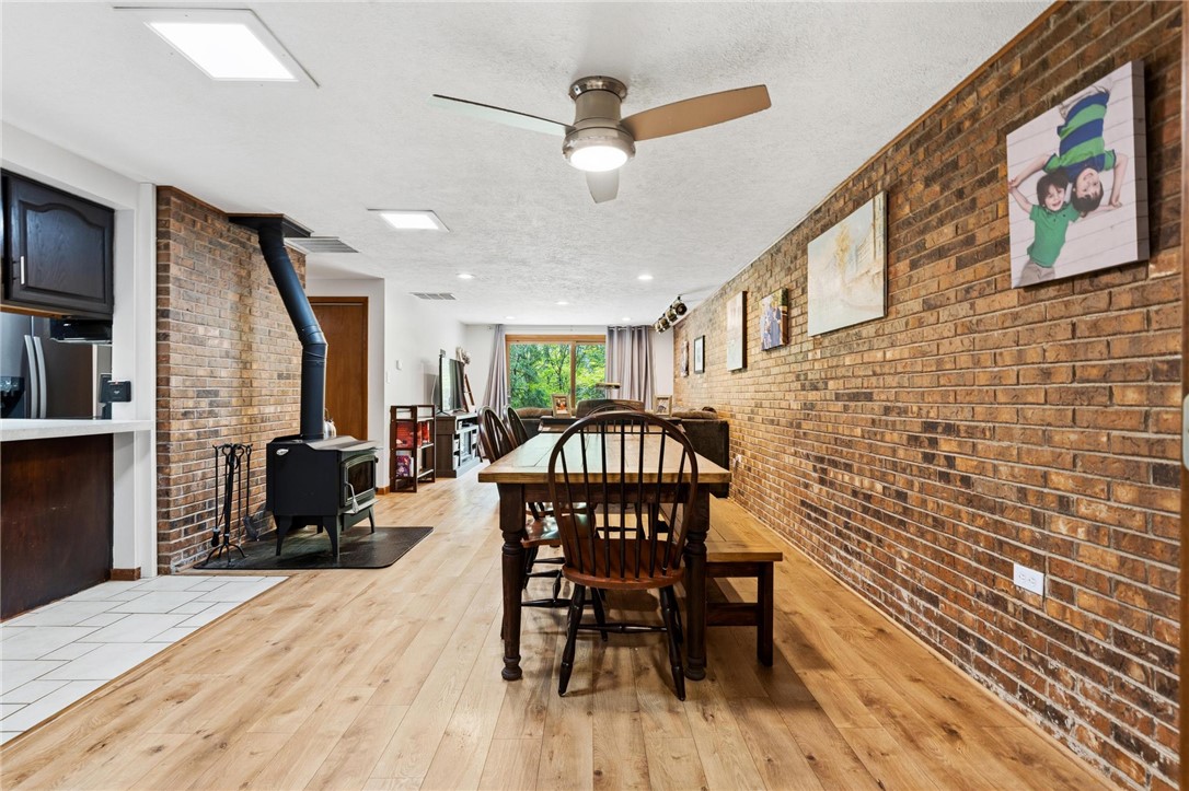 1940 Armstrong Road Fairborn, OH 45324 - Photo 17 of 48 This inviting interior features a brick accent wall and durable wood flooring.