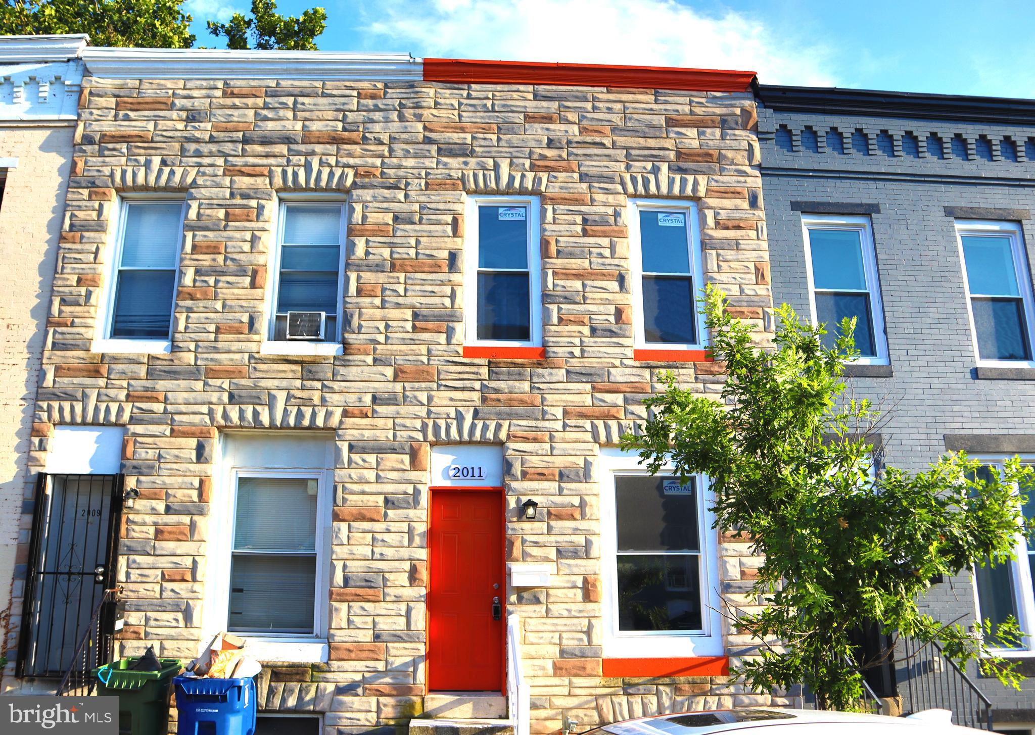 2011 Hollins Street Baltimore, MD 21223 - Photo 1 of 15 a front view of a building