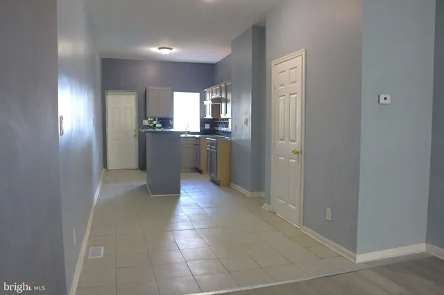 a large bathroom with a sink and a large mirror
