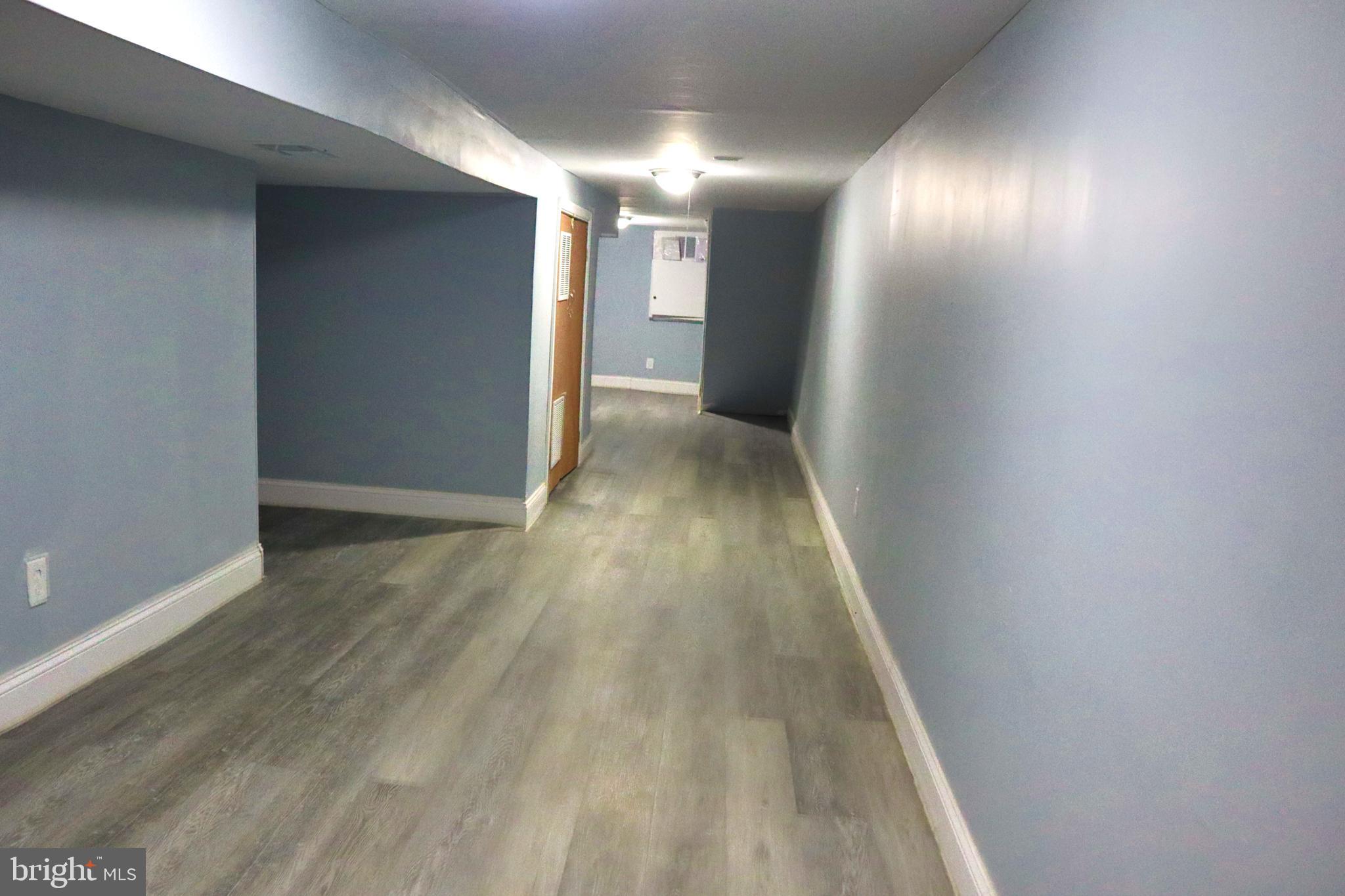 2011 Hollins Street Baltimore, MD 21223 - Photo 3 of 15 a view of hallway with wooden floor