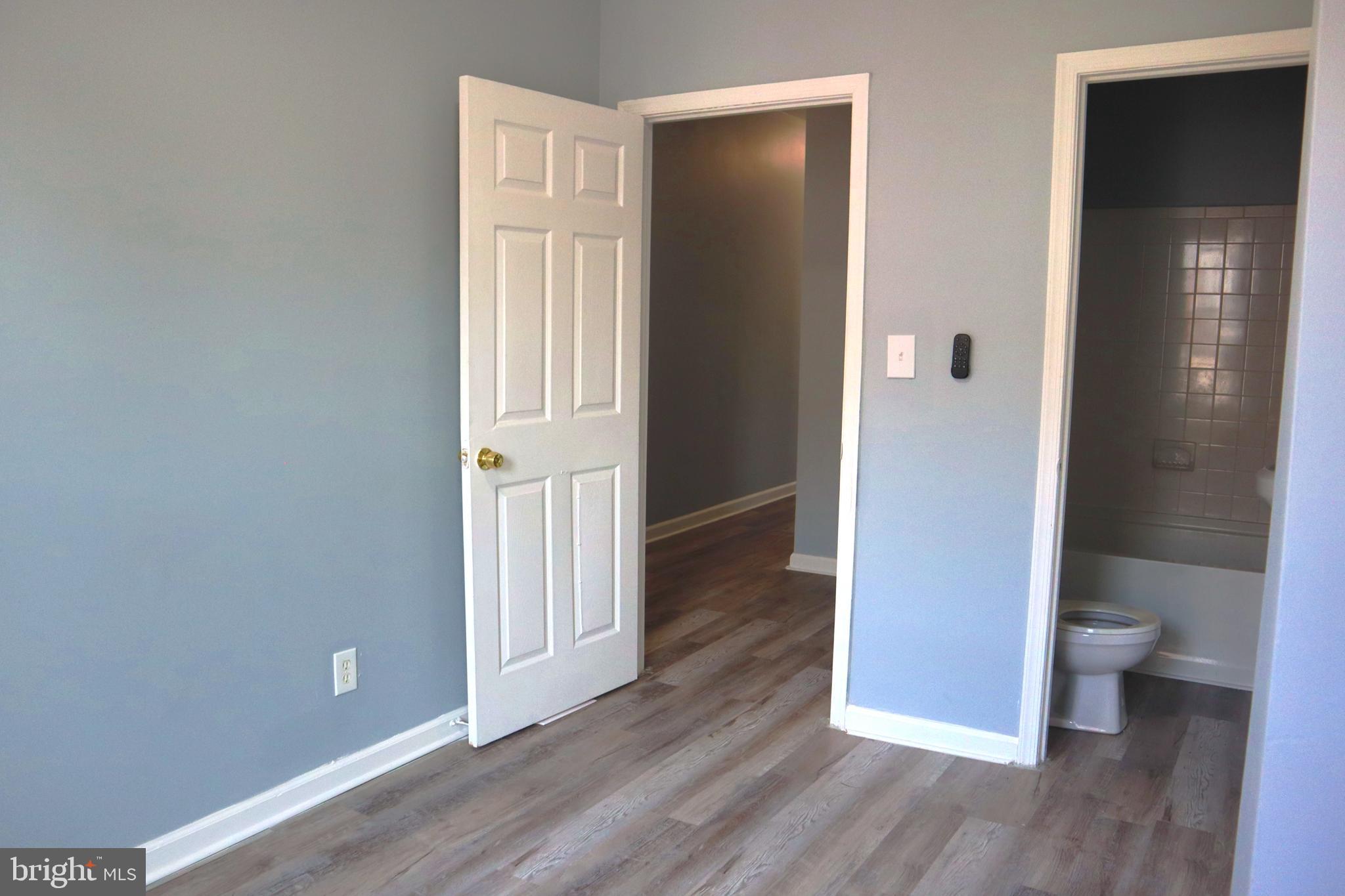 2011 Hollins Street Baltimore, MD 21223 - Photo 9 of 15 wooden floor and windows in a room