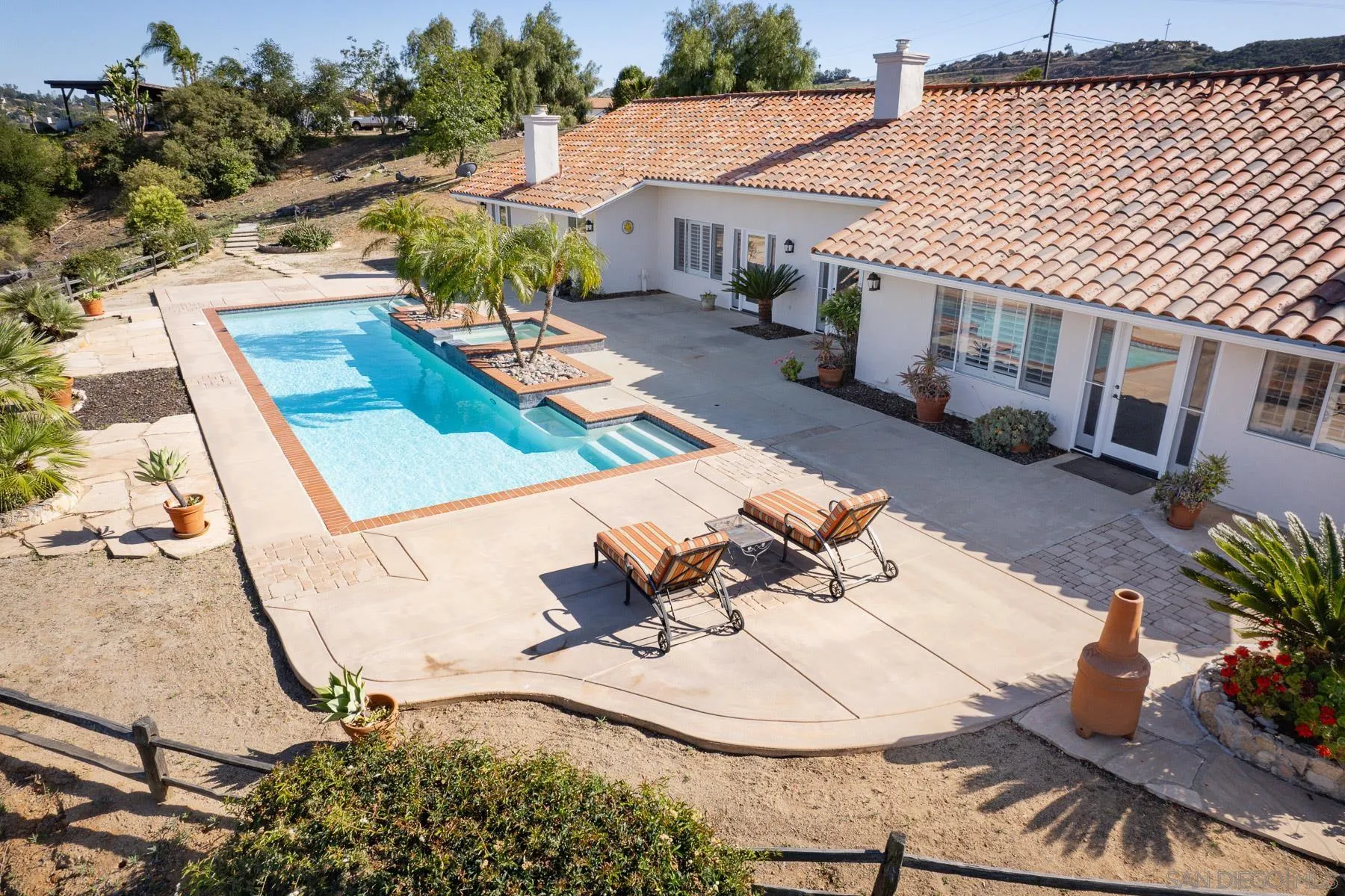 a view of a house with chairs