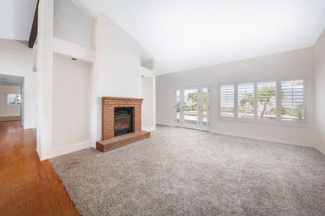 a view of a room with cabinet and windows