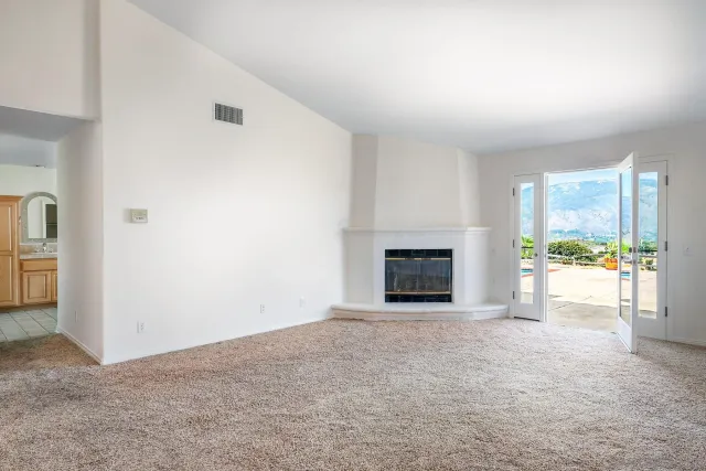 a large bathroom with a double vanity sink a mirror and a bathtub