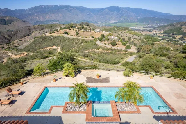 a view of swimming pool from a balcony