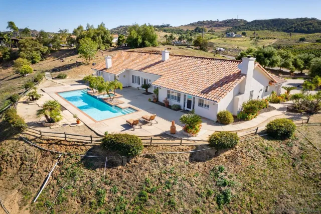 a view of a swimming pool with a lounge chair