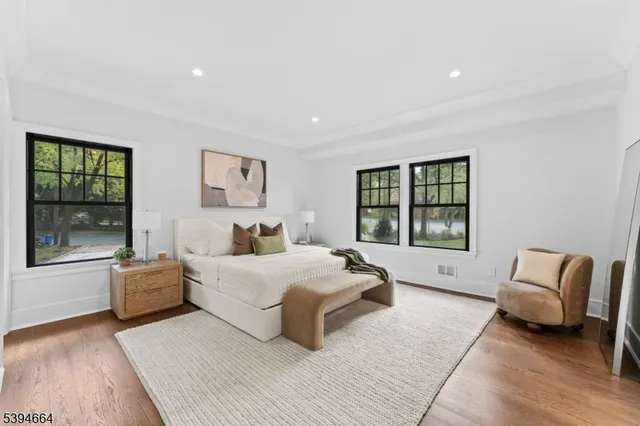 a spacious bedroom with a large bed and a couch