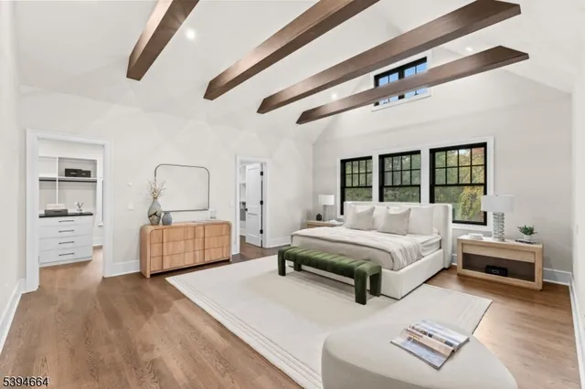 a bedroom with furniture and window