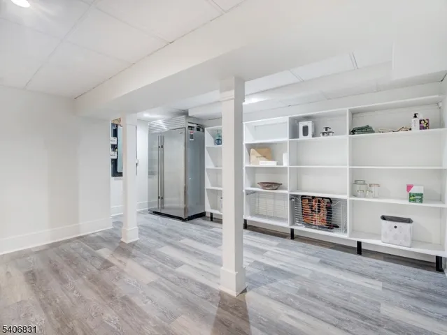 a view of a livingroom with wooden shelves